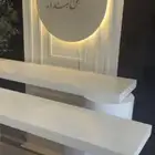طاولتين استقبال وخلفيه بالاسم