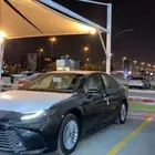 كامري 2025 اسود اي بلس هايبرد E-plus