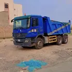قلابات شيول وبكلين لإيجار يومي أو شهري أسفلت مقشور