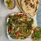 لدينا سمك مشوي مسكوف ع الطريقه العراقيه وخبز تنور