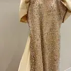 فستان سهره ذهبي مطرز بالورود