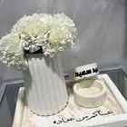 قطع مصنوعه من الجبس والاسمنت بالاسم او عباره