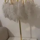 لمبه أستيل ذهبي مع ريش