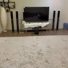 شاشه بلازما 65 وسماعات وطاوله