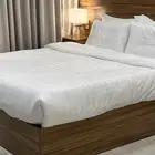 غرفة نوم فندقية وجلسة جانبية للإ  يجااار