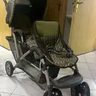 عربة أطفال توأم