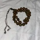 مسبحه فاتوران 33 حبه اللون عودي