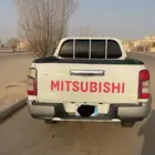 متسبيشي L200 ماشيه 159الف موديل 2022 معي من وكالتها