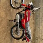 دباب سزوكيAx100