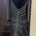 فستان جديد مااستخدم ولامره سبب البيع المقاس كبير