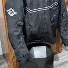 جاكيت دراجة وشنطة ظهر