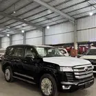 تويوتا جي اكس ار 2025 بنزين L4 جلد شاشات سعودي اللون اسود