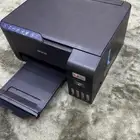 طابعة مع جميع مستلزماتها لصنع الدفاتر