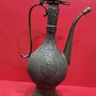 إبريق نحاس منقوش بالكامل