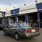 للبيع كامري 99 محول 2001 السياره مرشوشه كامله وبدون مكينه