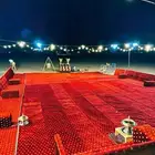 للرحلات البرية ثلاث عمال وبيت شعر وبرميل مندي