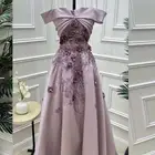 فستان بنفسجي مزين بخرز و ورود