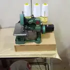 مكينة خياطة صغيرة و منيكان