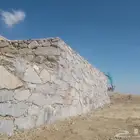 بناء جدرانات بجميع انوعها حجر كبير وصغير ولبيس بيوت تراثي