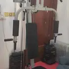 home gym machine with bench press and weights