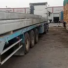 شاحنة مسطحة متاحة للإيجار نقوم بتحميل كل شيء