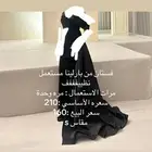 فستان اسود من بارلينا وشنطة يد سوداء سيليستيا