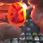 حجر عقيق يماني مصور وجه حرمة ببرقع وطير وثعبان