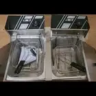 قلاية كهربائية عميقة مزدوجة  وهي جهاز يستخدم لقلي الأطعمة في