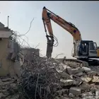 بوكلين لبنيان الحجر وقص الاراضي