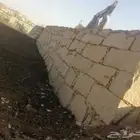 بناء جدران حجر بوكلين شيول وقص ارضيات ونقل ردميات