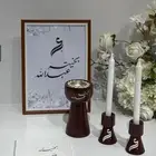 مبخرة خشب باللون البني مع شمعدان
