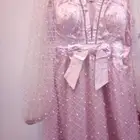 فستان سهره نسا  ي اللون وردي ب اكمام طويله وشفافه