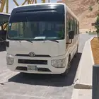 Coaster bus for rent with driver