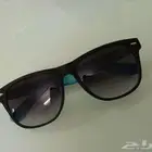نظارة شمسية سوداء من الخارج سماوية من الداخل (مستعملة)