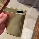 علب تنك تمر وجوالين زيت زيتون