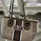 شنطه نسائية بحروف H.M