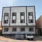 عمارة لسكن الشركات في حي الروابي