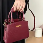 متجر_كاتشي شنطة نسائية من دكني بلون المشمش جلد