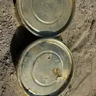 تنك ذهبي وعلب فول عامي