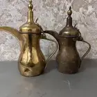 دلة الرسلان القديمه وحده مربوبه والثانيه ع وضعها مقاس صغير