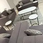 كنب مع طاولات والسجاد