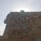 بكلين لبناء الحجر وقص الاراضي ولهدم المباني اتالفه