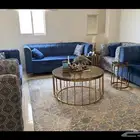 طقمين كنب مع السجاد والطاولات الي بنصف