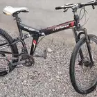 بسكليت جنط 26 جبلي عنده مساعدات أماميه وا خلفيه