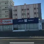 ارض تجارية عليها محلات مؤجرة
