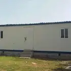 بركس غرفتين ومطبخ وحمام جدرانه ليس هنجر ساندوتش معزول