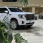 يوكن 2023 قصير SLT الجميح تحت الضمان.