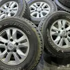 كفرات دنلوب مقاس 275 65 17 مع جنوط اصلي جيب لاند كروزر