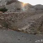 بكلين وقلاب لقص الأراضي وبنيان الحجر وهدم العماير وحفر