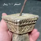 مجسم صغير على شكل نقيره نجدية وبعض التراثيات